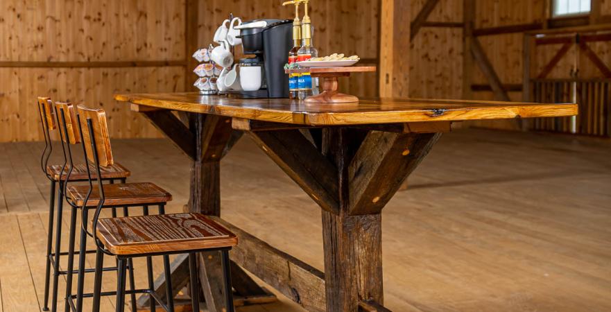 Table, stools, and light fixture made from reclaimed barn timbers